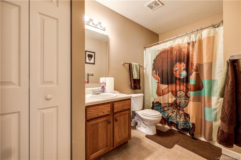 8808 Old Potters Road Charlotte, NC 28269 - Photo 24 of 34 a bathroom with a sink toilet and shower