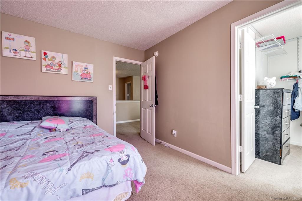 8808 Old Potters Road Charlotte, NC 28269 - Photo 26 of 34 a bedroom with a bed and a view of bathroom