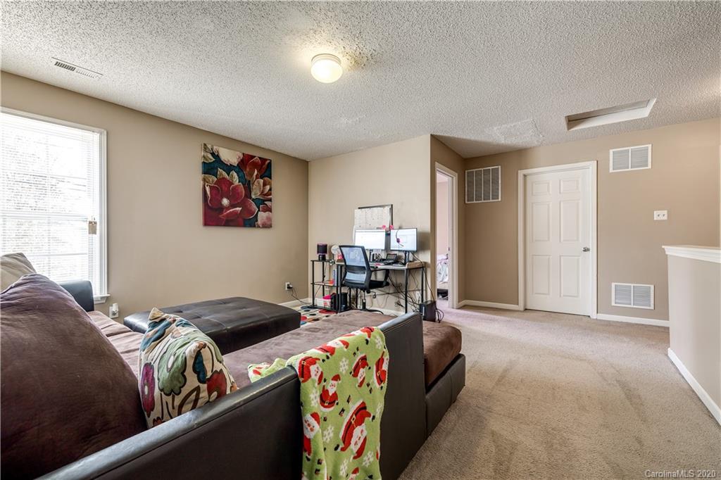 8808 Old Potters Road Charlotte, NC 28269 - Photo 30 of 34 a bedroom with bed and a window