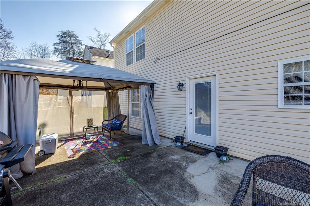 8808 Old Potters Road Charlotte, NC 28269 - Photo 31 of 34 a backyard of a house with outdoor seating