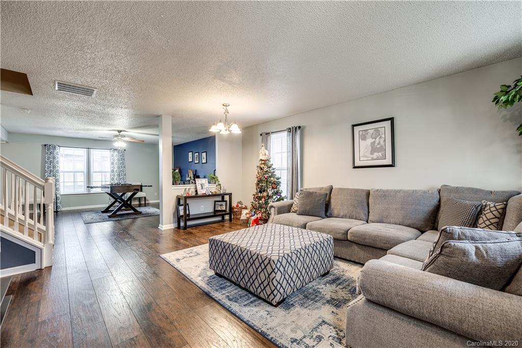 8808 Old Potters Road Charlotte, NC 28269 - Photo 5 of 34 a living room with furniture and a wooden floor