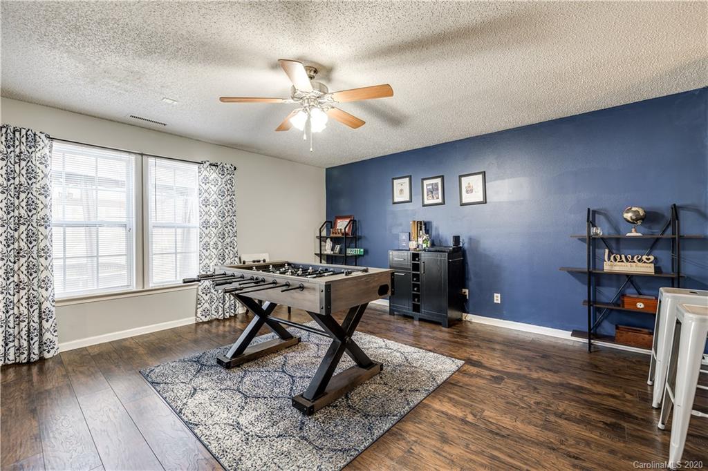 8808 Old Potters Road Charlotte, NC 28269 - Photo 7 of 34 a view of a livingroom with workspace and a window