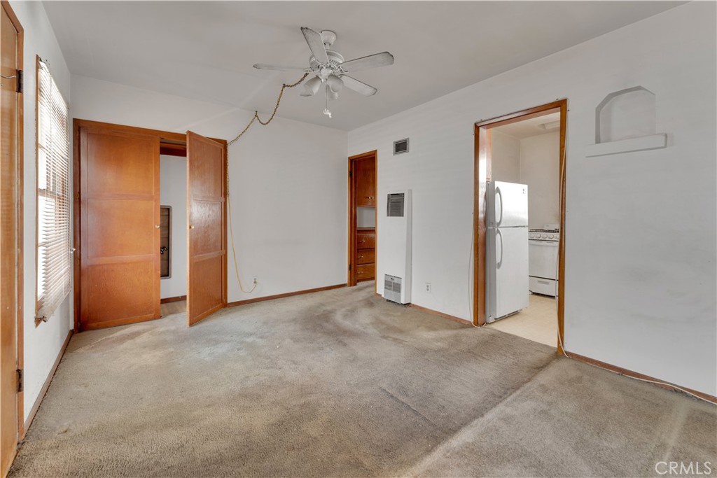 34 North 1st Street, Unit 7 Alhambra, CA 91801 - Photo 2 of 7 an empty room with chandelier fan and closet