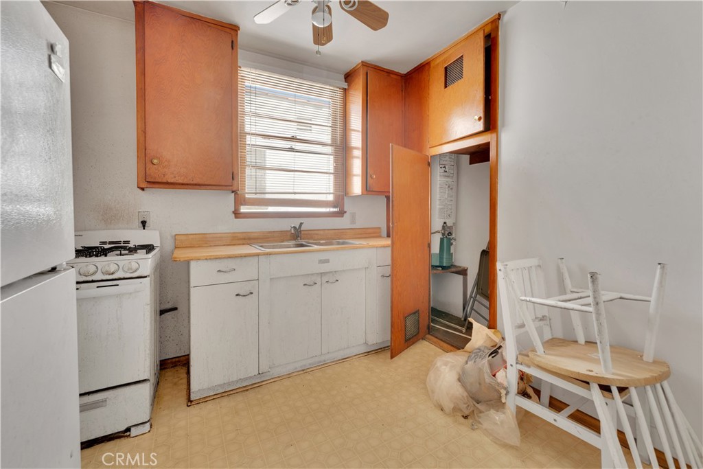 34 North 1st Street, Unit 7 Alhambra, CA 91801 - Photo 3 of 7 a view of a kitchen with sink microwave and cabinets