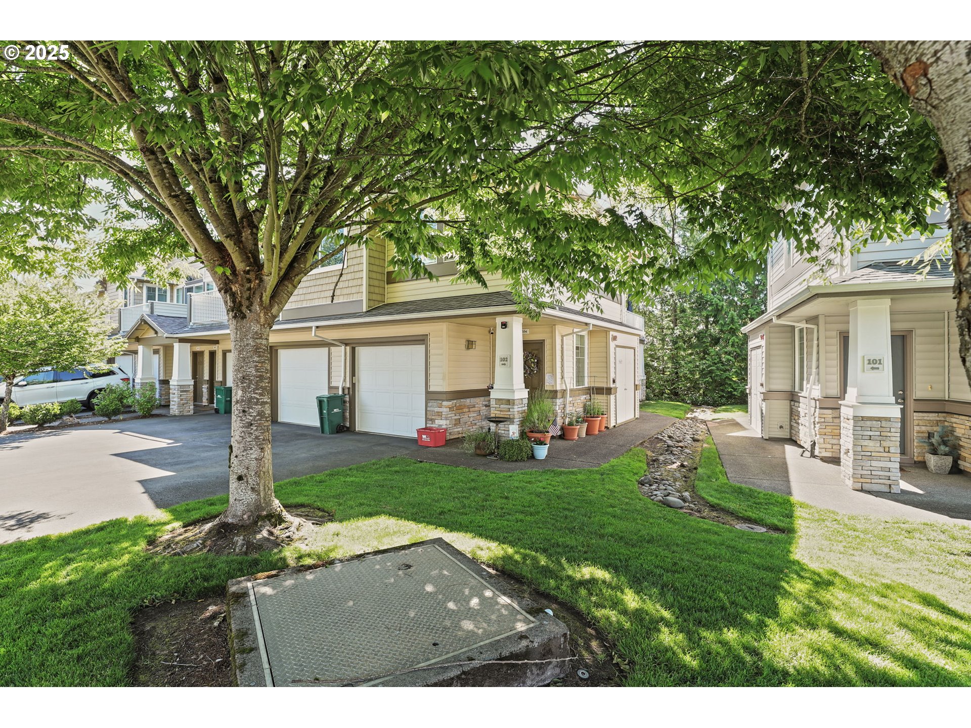 a backyard of a house with table and chairs
