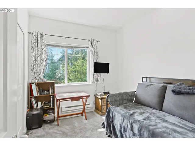 a view of a hallway with closet and a couch