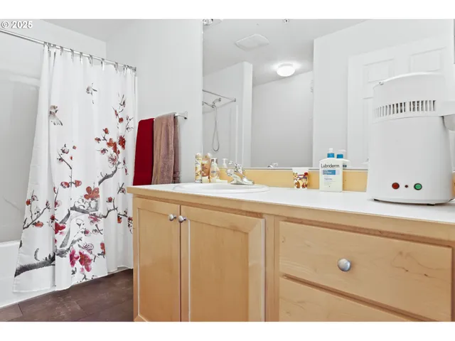 a living room with furniture a window and a flat screen tv