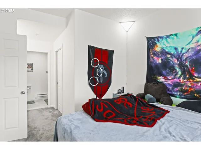 a bedroom with a bed and a table in it