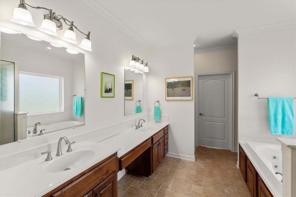 345 Rains County Road 3390 Emory, TX 75440 - Photo 26 of 39 a spacious bathroom with a double vanity sink a mirror and a shower