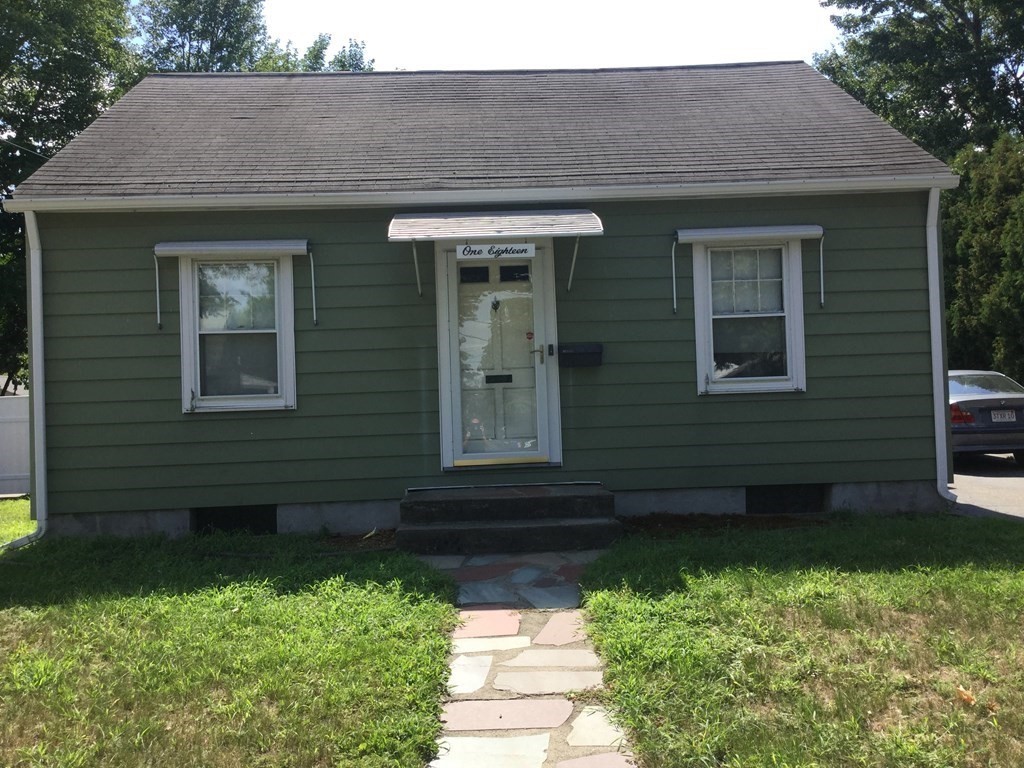 118 Merrimac Avenue Springfield, MA 01104 - Photo 1 of 20 a front view of a house with a yard