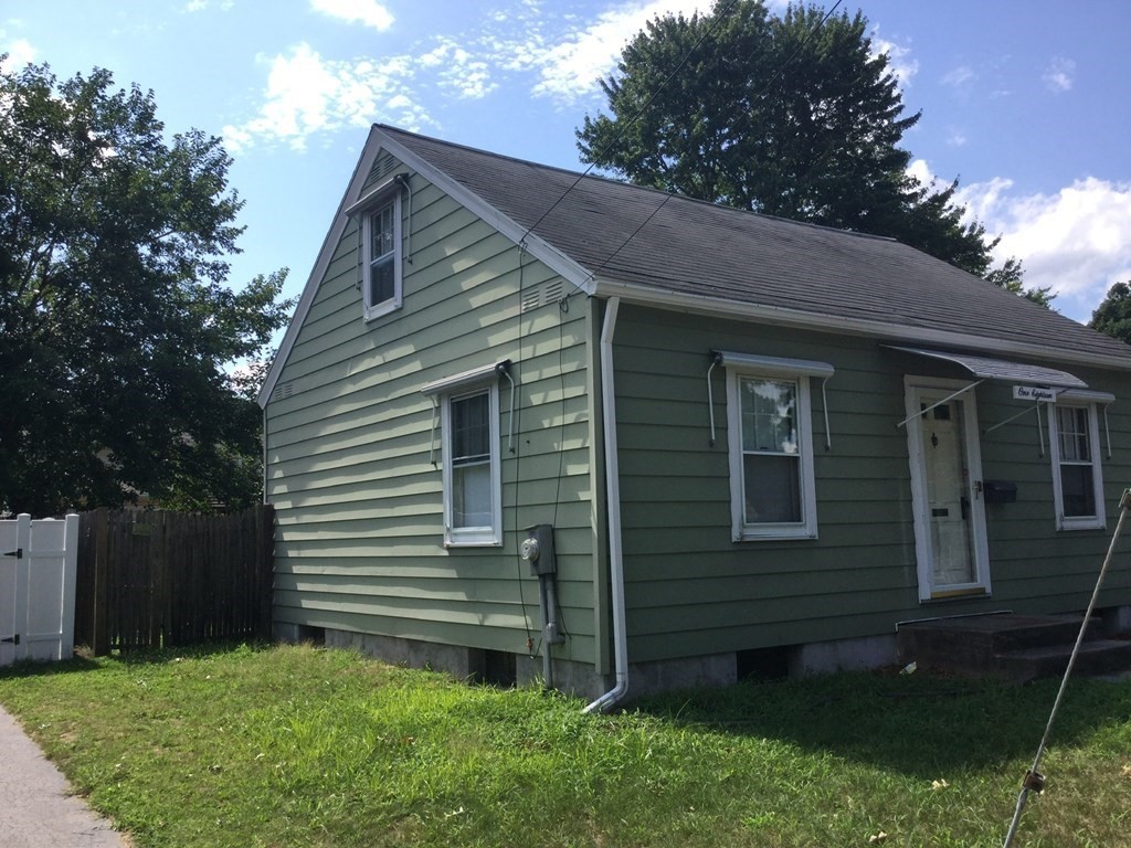 118 Merrimac Avenue Springfield, MA 01104 - Photo 2 of 20 a view of a house with a yard
