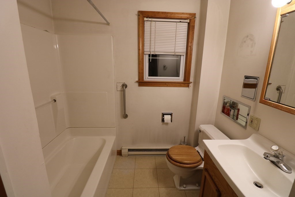 118 Merrimac Avenue Springfield, MA 01104 - Photo 8 of 20 a bathroom with a sink toilet and shower