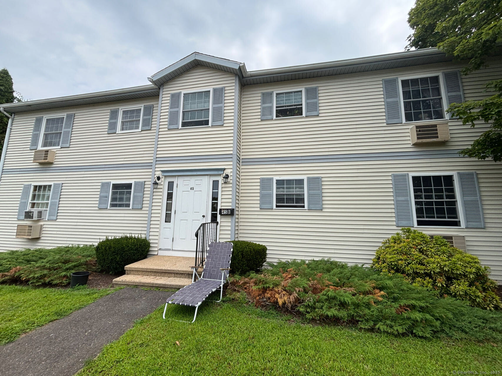 45 Crystal Lane, Unit D Mansfield, CT 06268 - Photo 1 of 11 a view of a house with a backyard