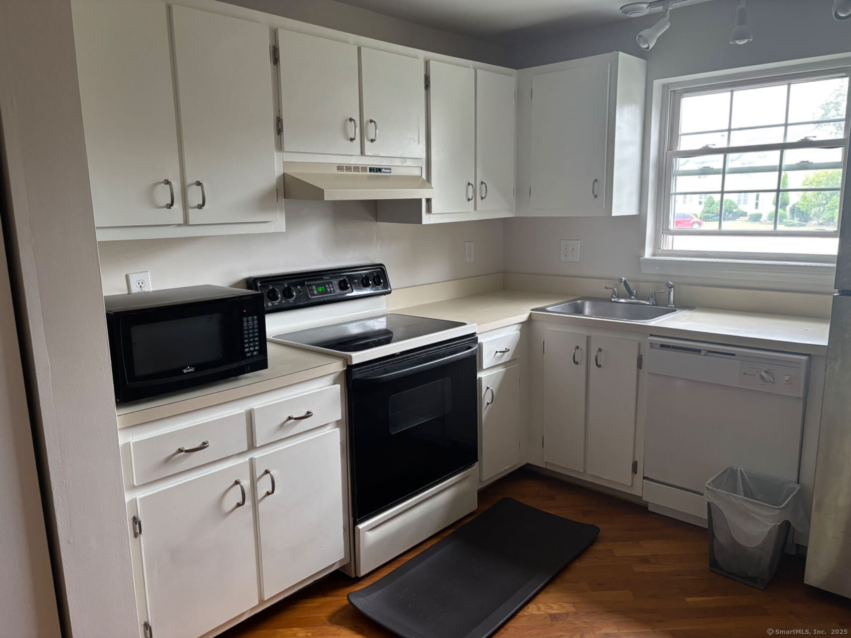 45 Crystal Lane, Unit D Mansfield, CT 06268 - Photo 8 of 11 a kitchen with cabinets appliances and a window