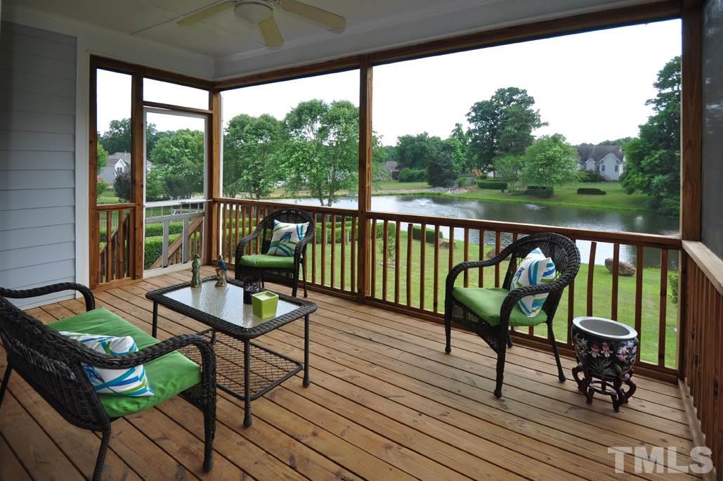 473 May Farm Road Pittsboro, NC 27312 - Photo 6 of 25 Enjoy relaxing on the screen porch listening to the fountain with a beautiful pond view.
