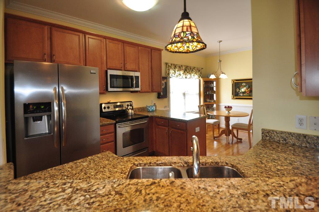 473 May Farm Road Pittsboro, NC 27312 - Photo 8 of 25 Stainless steel appliances just two years old, granite counters, and pantry.