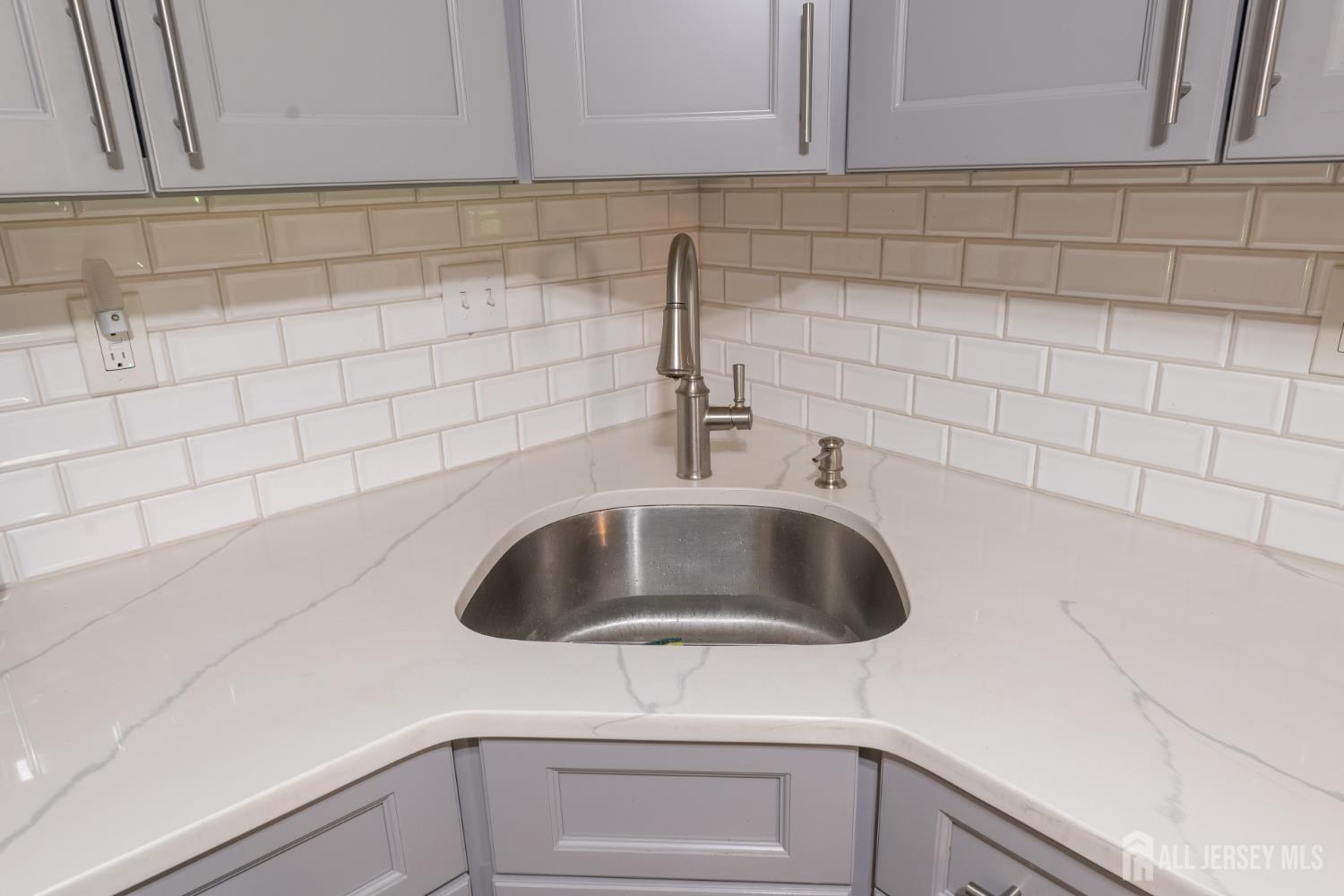 13 Mine Road Jamesburg, NJ 08831 - Photo 19 of 52 a kitchen with a sink and cabinets