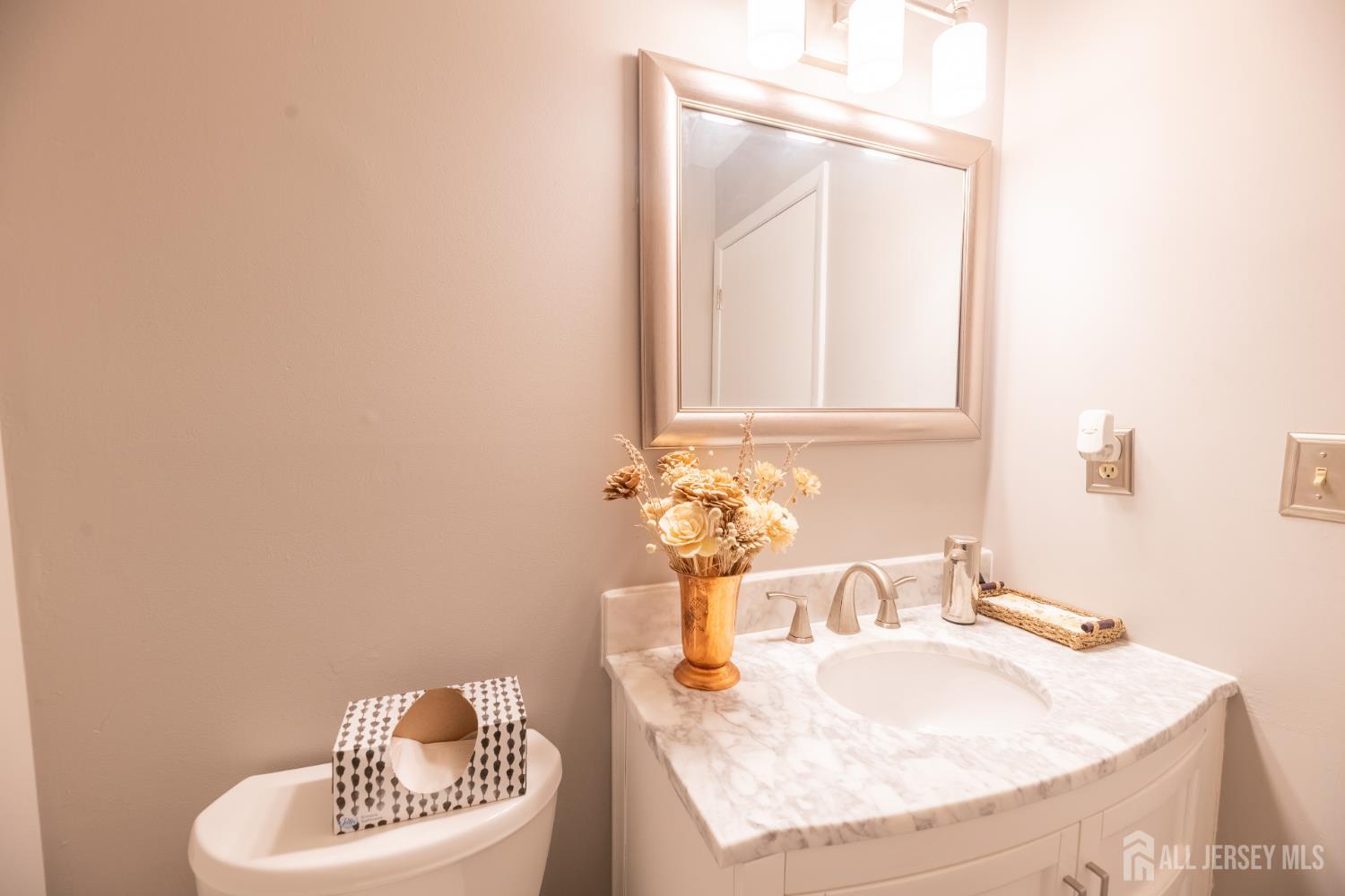 13 Mine Road Jamesburg, NJ 08831 - Photo 25 of 52 a bathroom with a sink and a mirror