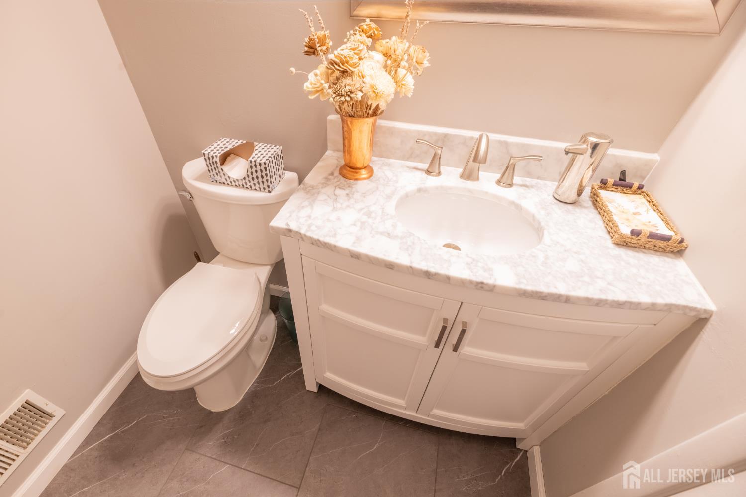 13 Mine Road Jamesburg, NJ 08831 - Photo 26 of 52 a bathroom with a toilet sink and mirror