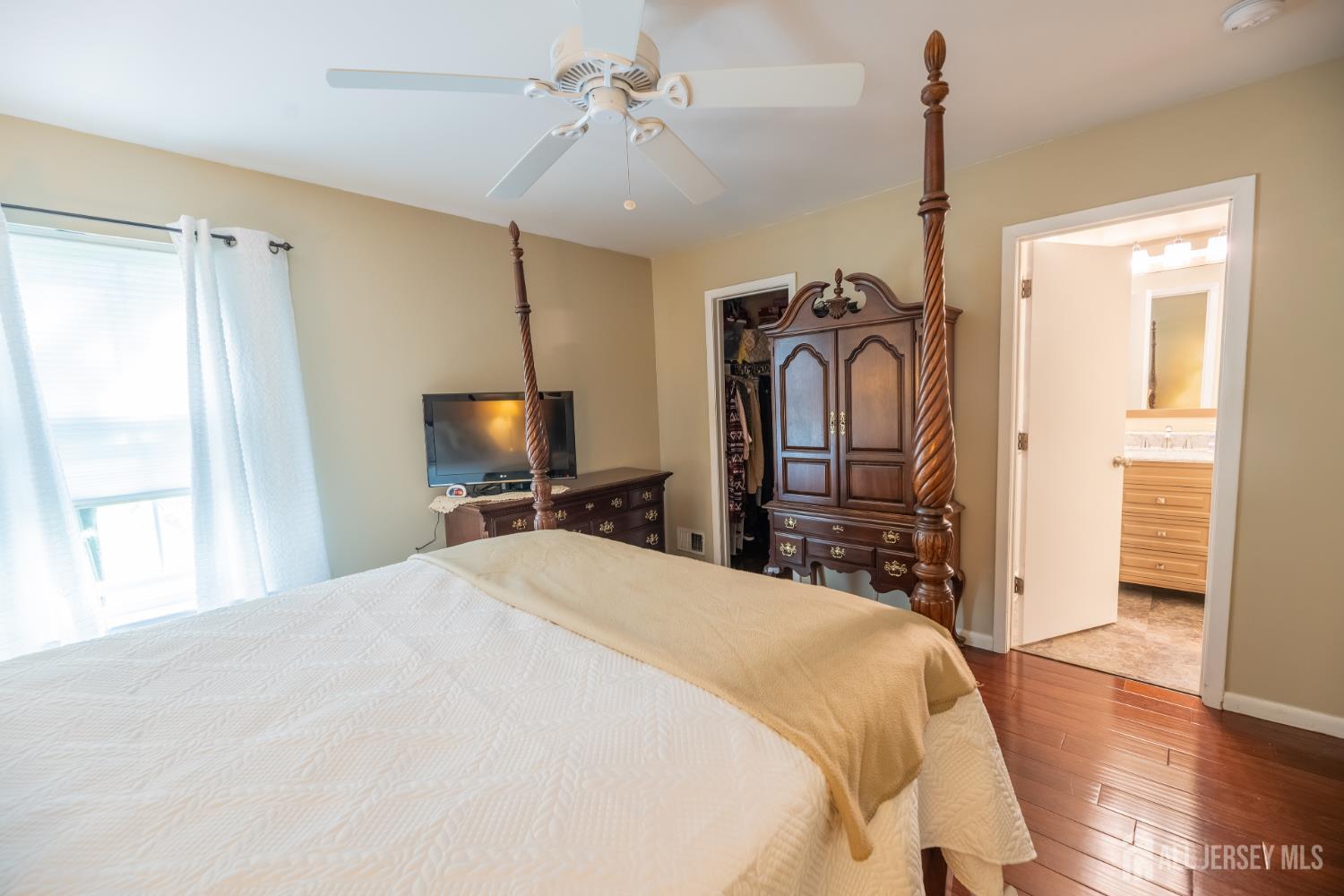 13 Mine Road Jamesburg, NJ 08831 - Photo 27 of 52 a bedroom with a bed and a television