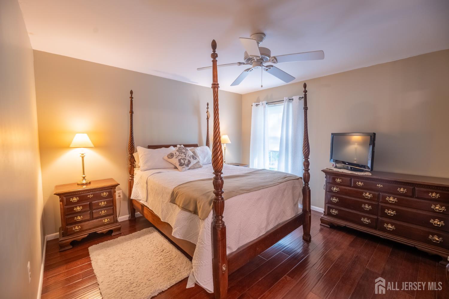 13 Mine Road Jamesburg, NJ 08831 - Photo 29 of 52 a bedroom with a bed and wooden floor
