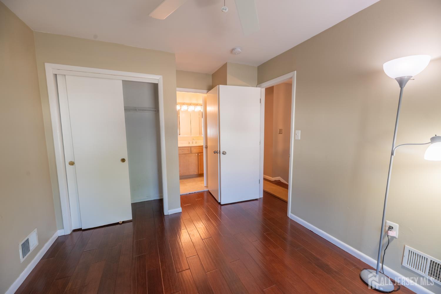 13 Mine Road Jamesburg, NJ 08831 - Photo 36 of 52 a view of an empty room with wooden floor and a window
