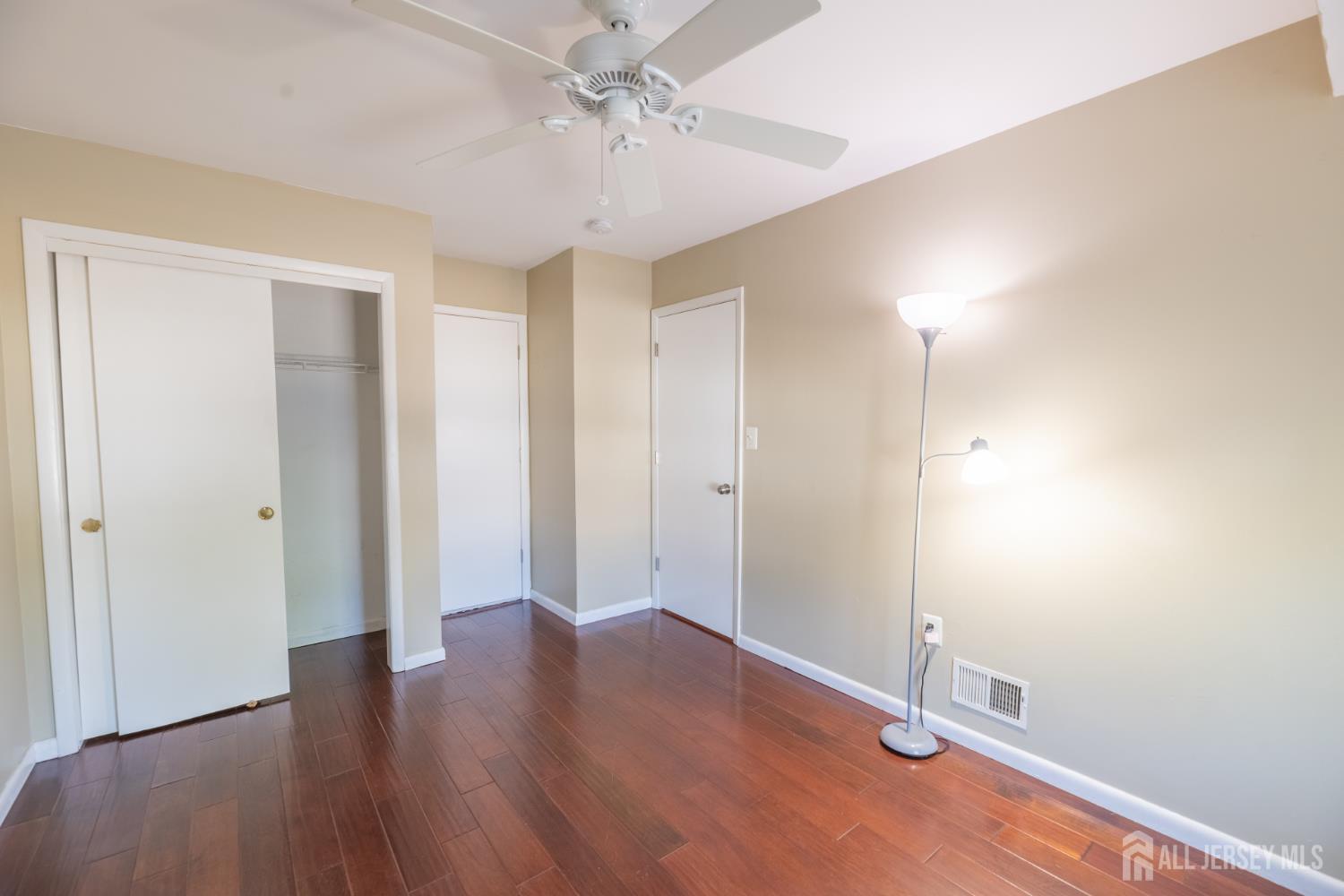 13 Mine Road Jamesburg, NJ 08831 - Photo 37 of 52 a view of an empty room with wooden floor