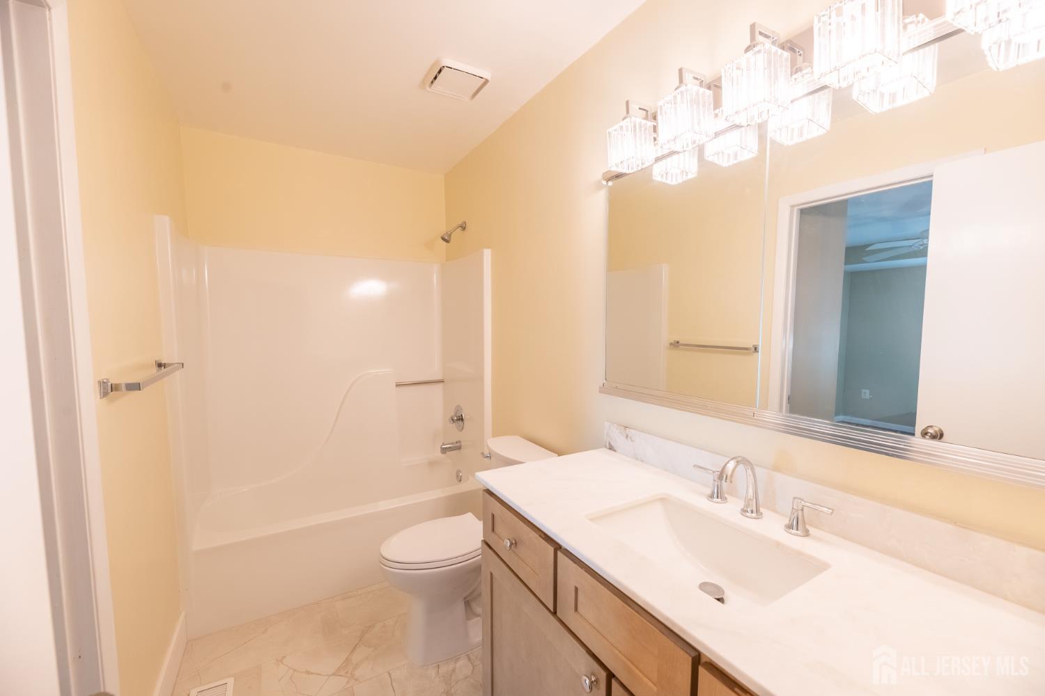13 Mine Road Jamesburg, NJ 08831 - Photo 39 of 52 a bathroom with a sink a toilet and shower