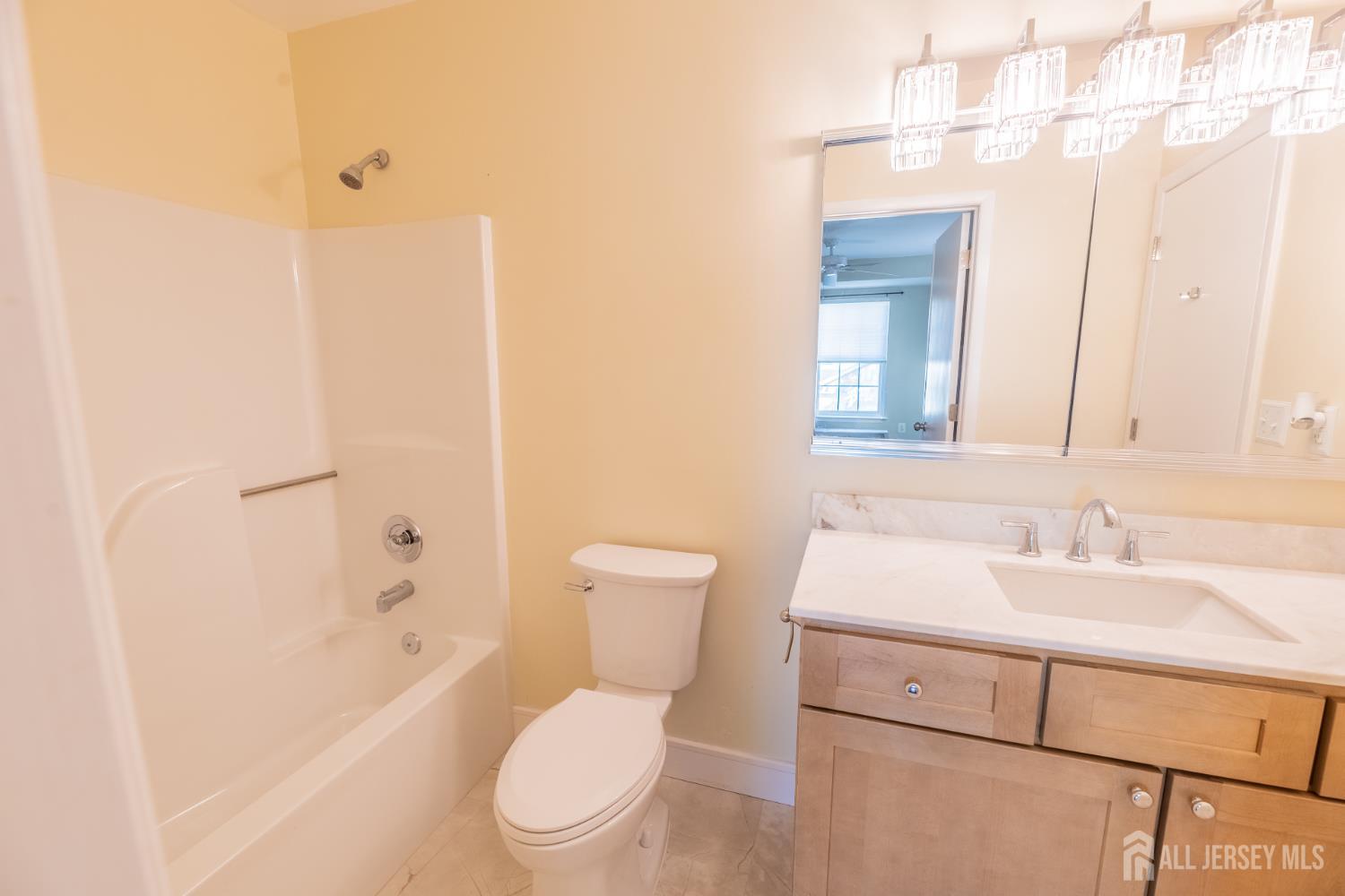 13 Mine Road Jamesburg, NJ 08831 - Photo 40 of 52 a bathroom with a sink a toilet and shower