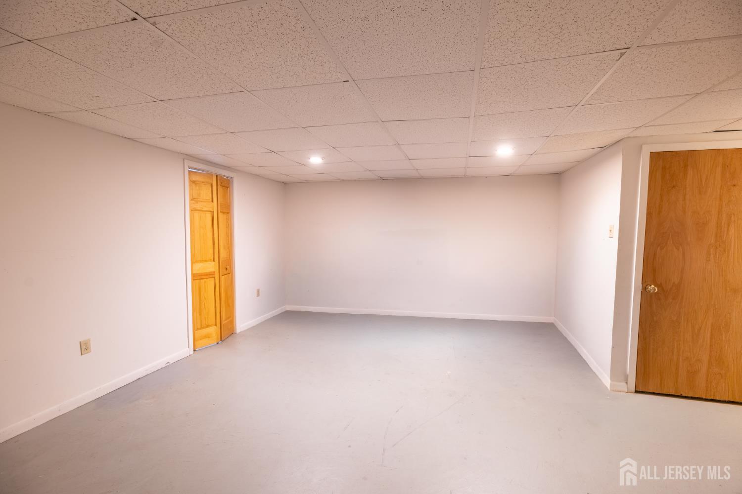 13 Mine Road Jamesburg, NJ 08831 - Photo 43 of 52 an empty room with a empty space and a window