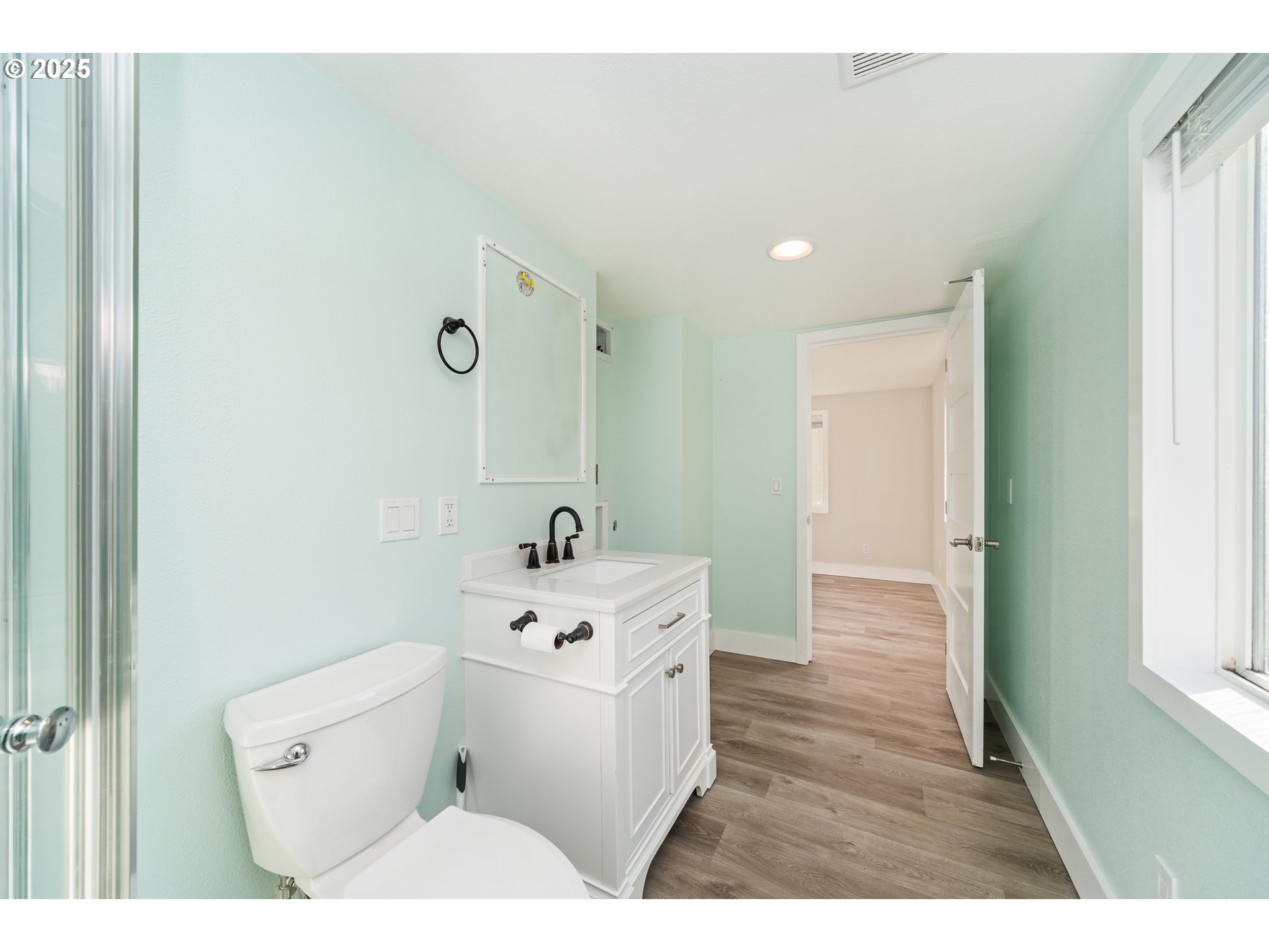 37000 Tohl Ranch Road, Unit 29 Nehalem, OR 97131 - Photo 15 of 46 a bathroom with a sink a toilet and a mirror