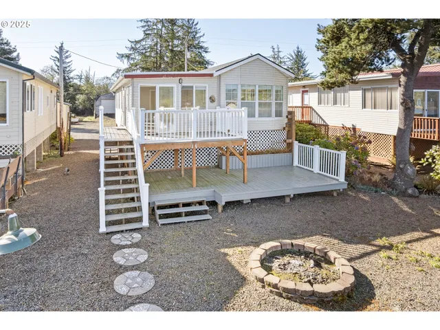 a view of a house with wooden fence