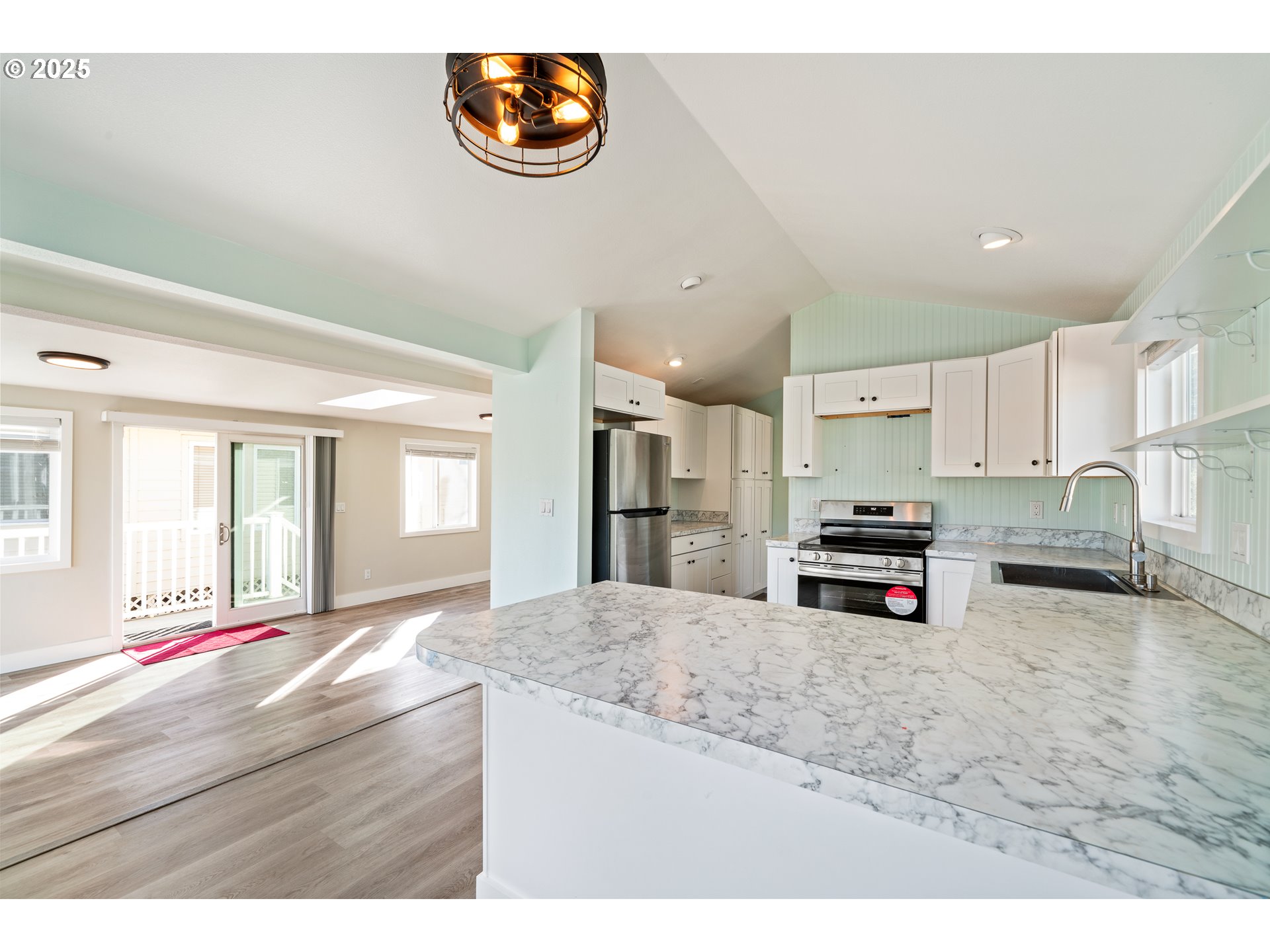 37000 Tohl Ranch Road, Unit 29 Nehalem, OR 97131 - Photo 8 of 46 a kitchen with stainless steel appliances a stove and cabinets