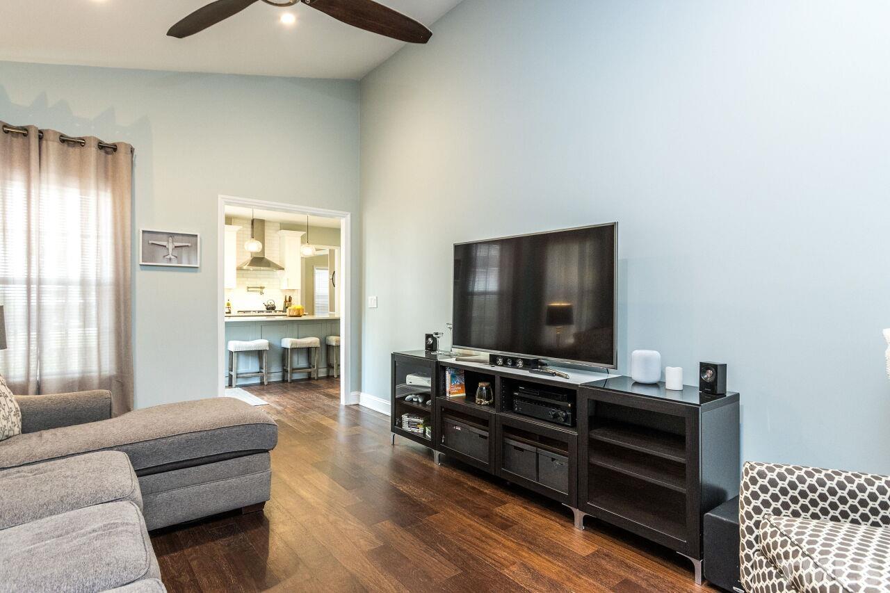 8215 Oneal Road Raleigh, NC 27613 - Photo 13 of 23 a living room with furniture and a flat screen tv