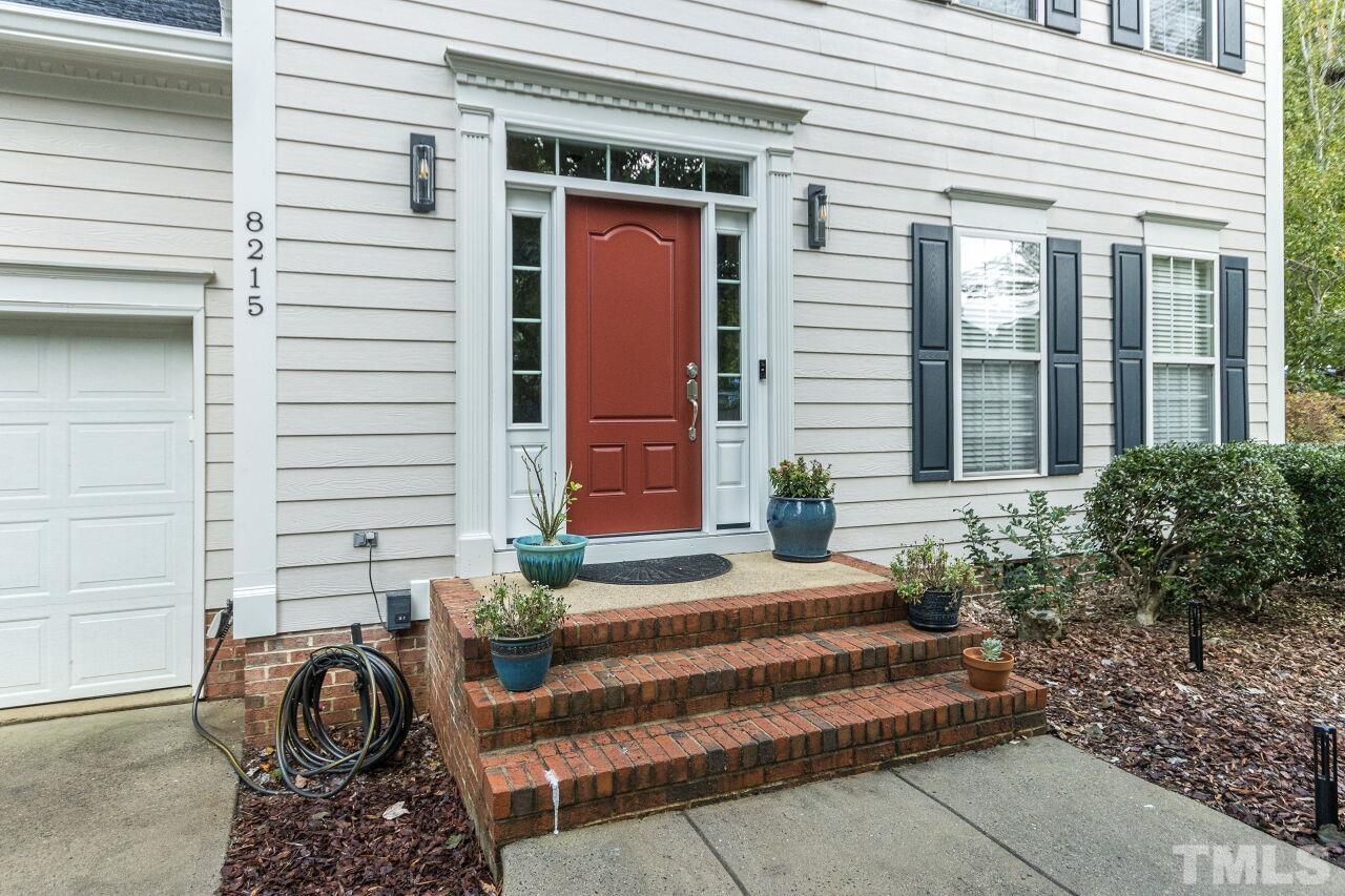 8215 Oneal Road Raleigh, NC 27613 - Photo 3 of 23 a front view of a house with outdoor seating and plants