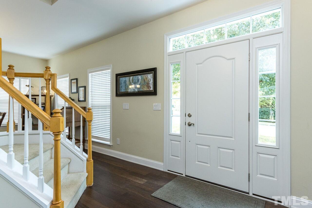 8215 Oneal Road Raleigh, NC 27613 - Photo 4 of 23 a view of entryway and hall with wooden floor