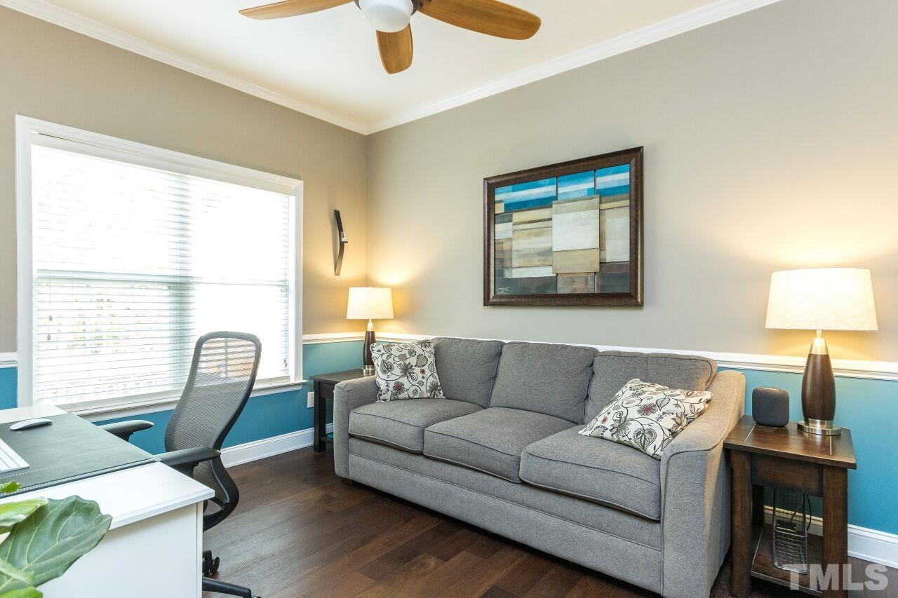 8215 Oneal Road Raleigh, NC 27613 - Photo 8 of 23 a living room with furniture and a window