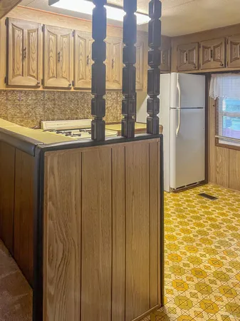 a view of a kitchen with a sink and a stove top oven