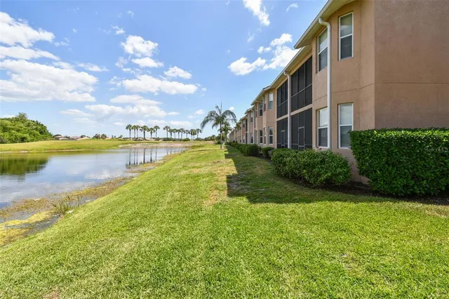 a view of a lake with a house in the background
