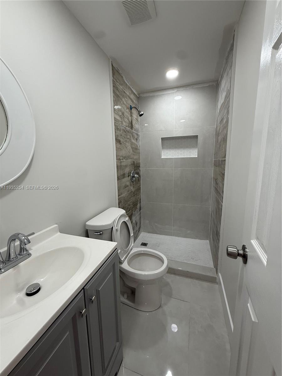 3445 Southwest 62nd Way, Unit 3445 Miramar, FL 33023 - Photo 4 of 6 a bathroom with a sink toilet and shower