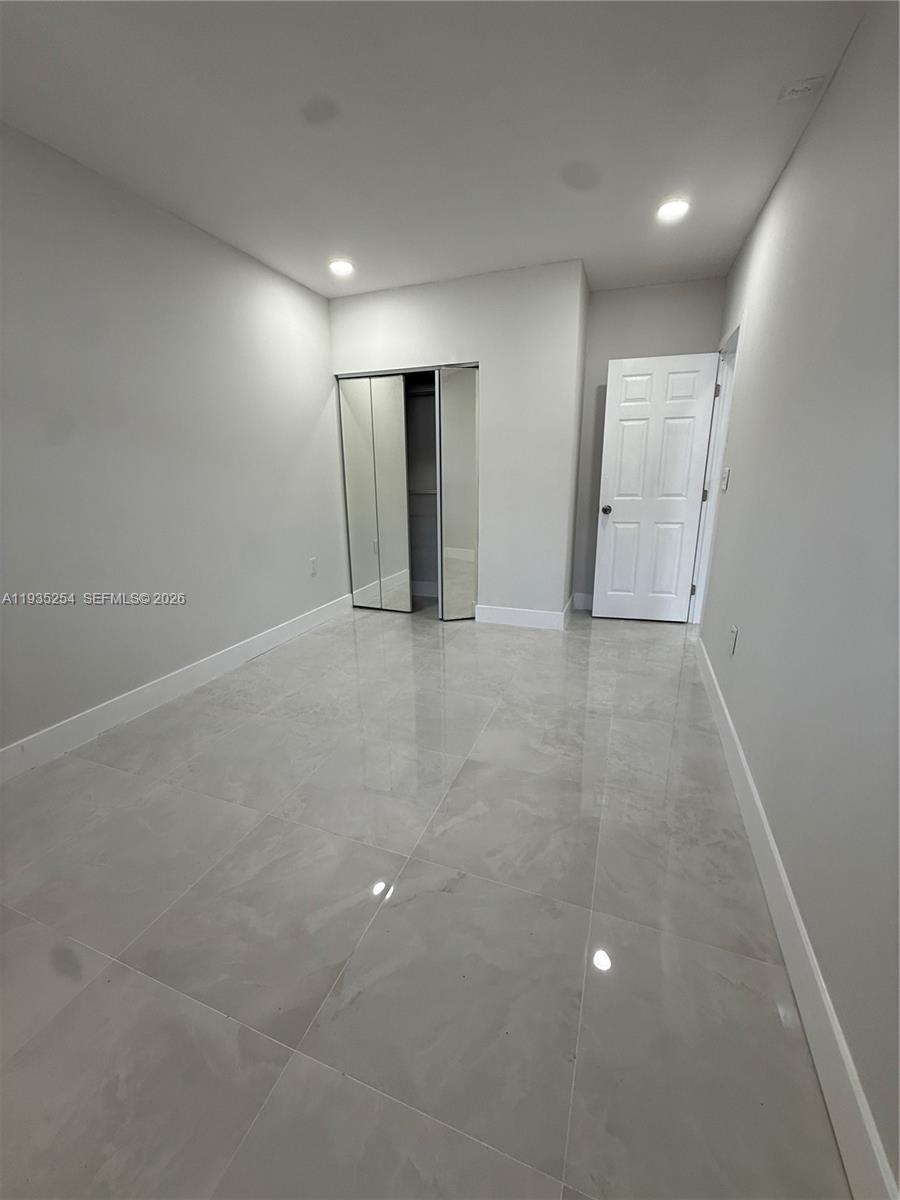 3445 Southwest 62nd Way, Unit 3445 Miramar, FL 33023 - Photo 6 of 6 an empty room with windows