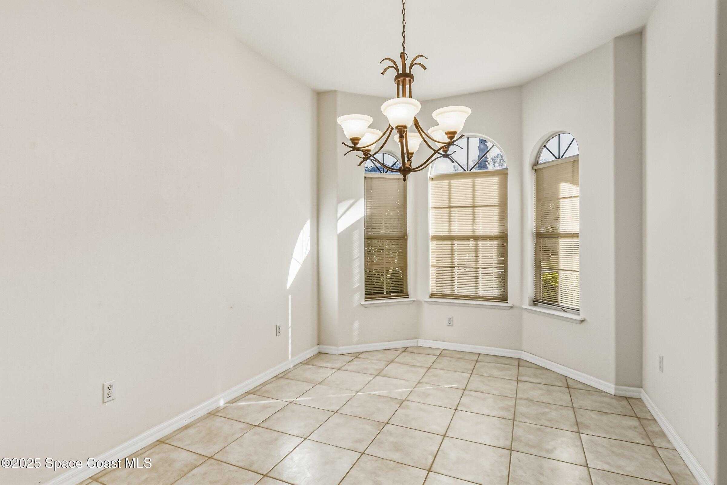 216 3rd Avenue Indialantic, FL 32903 - Photo 12 of 37 a view of an empty room with a window