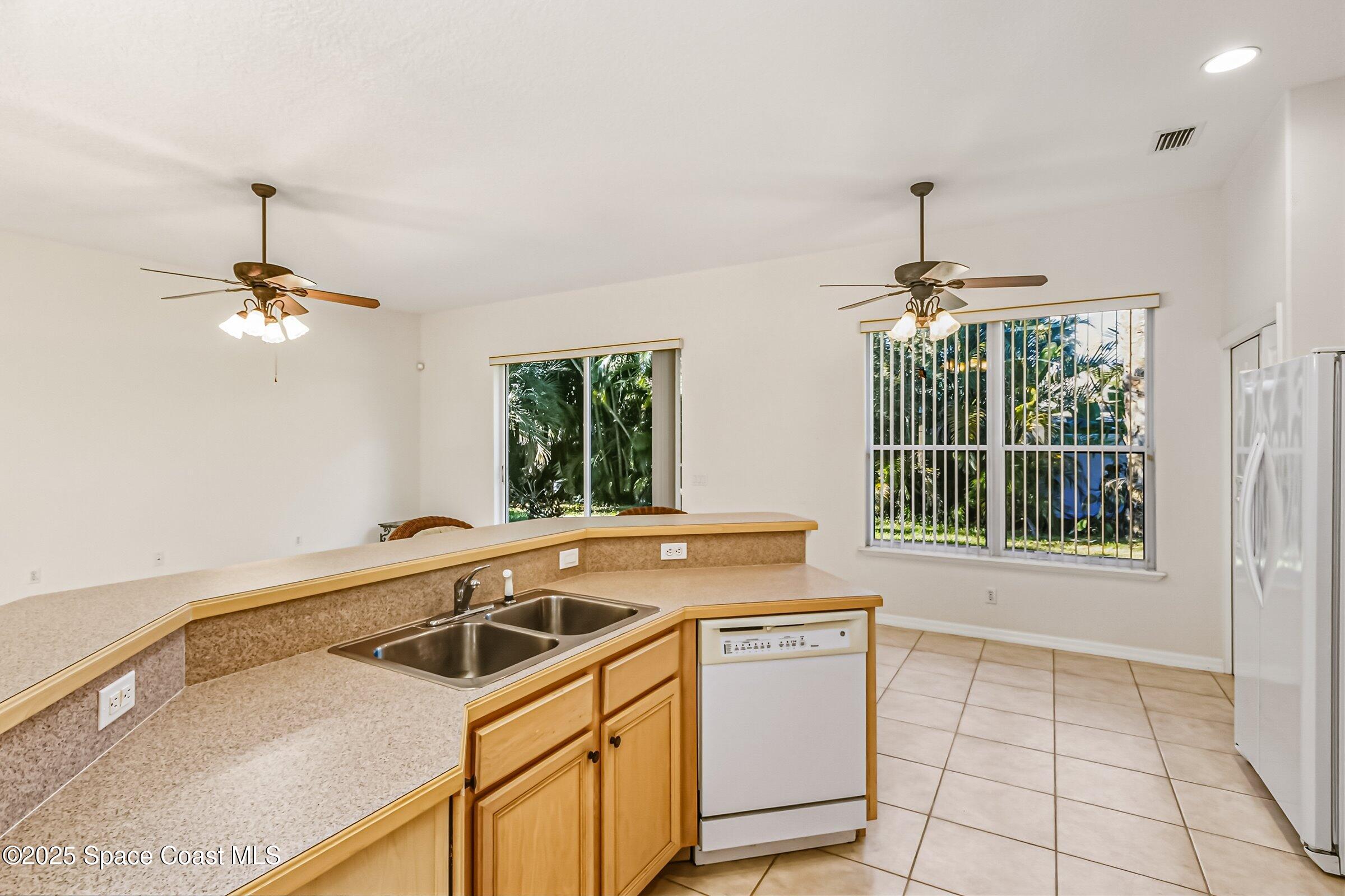 216 3rd Avenue Indialantic, FL 32903 - Photo 15 of 37 a view of a kitchen with a sink cabinets and a window