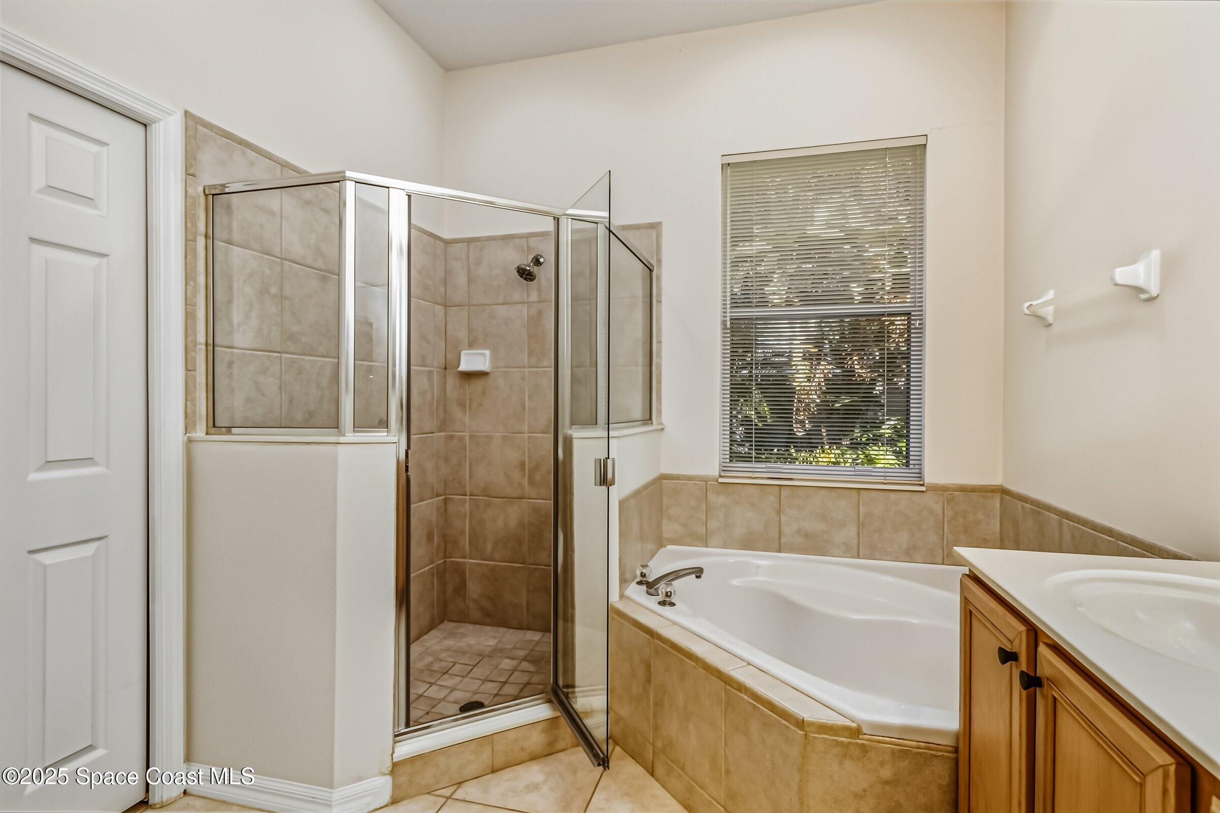 216 3rd Avenue Indialantic, FL 32903 - Photo 19 of 37 a bathroom with a tub shower and sink