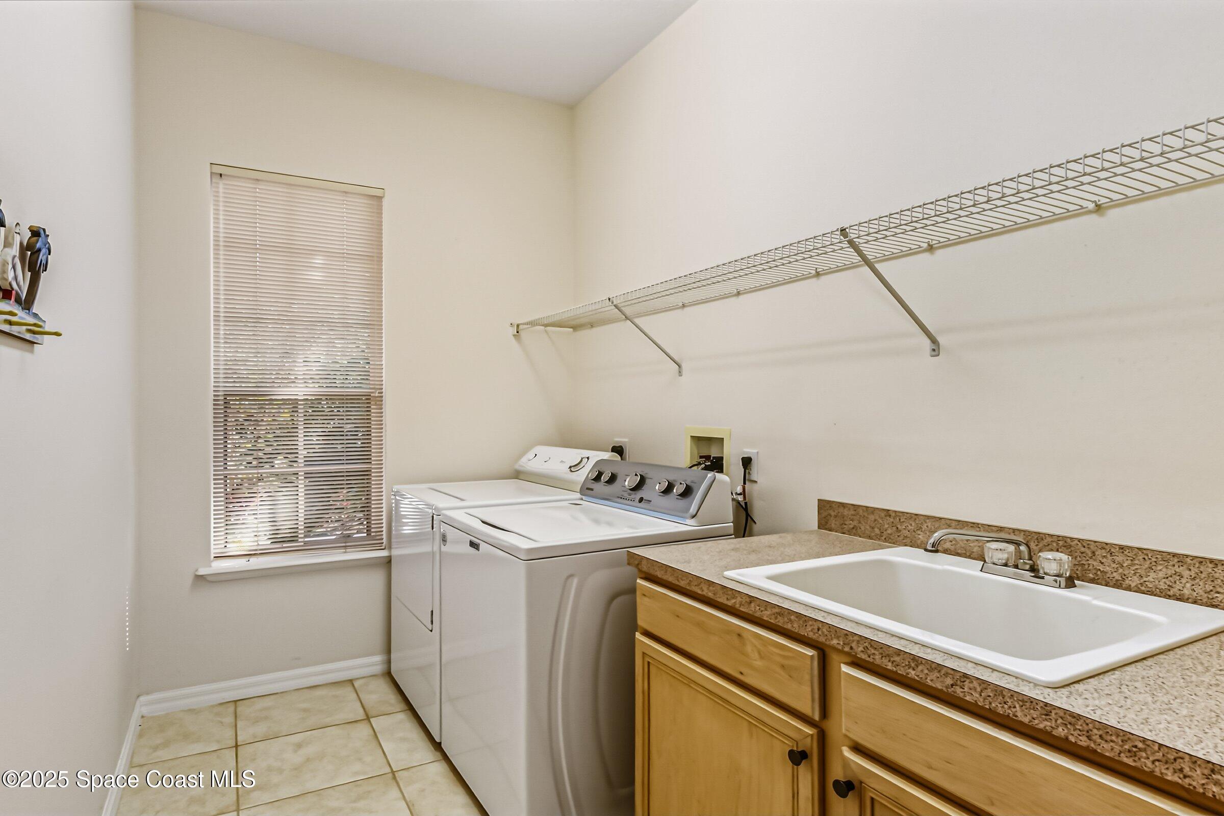 216 3rd Avenue Indialantic, FL 32903 - Photo 24 of 37 a utility room with dryer and washer