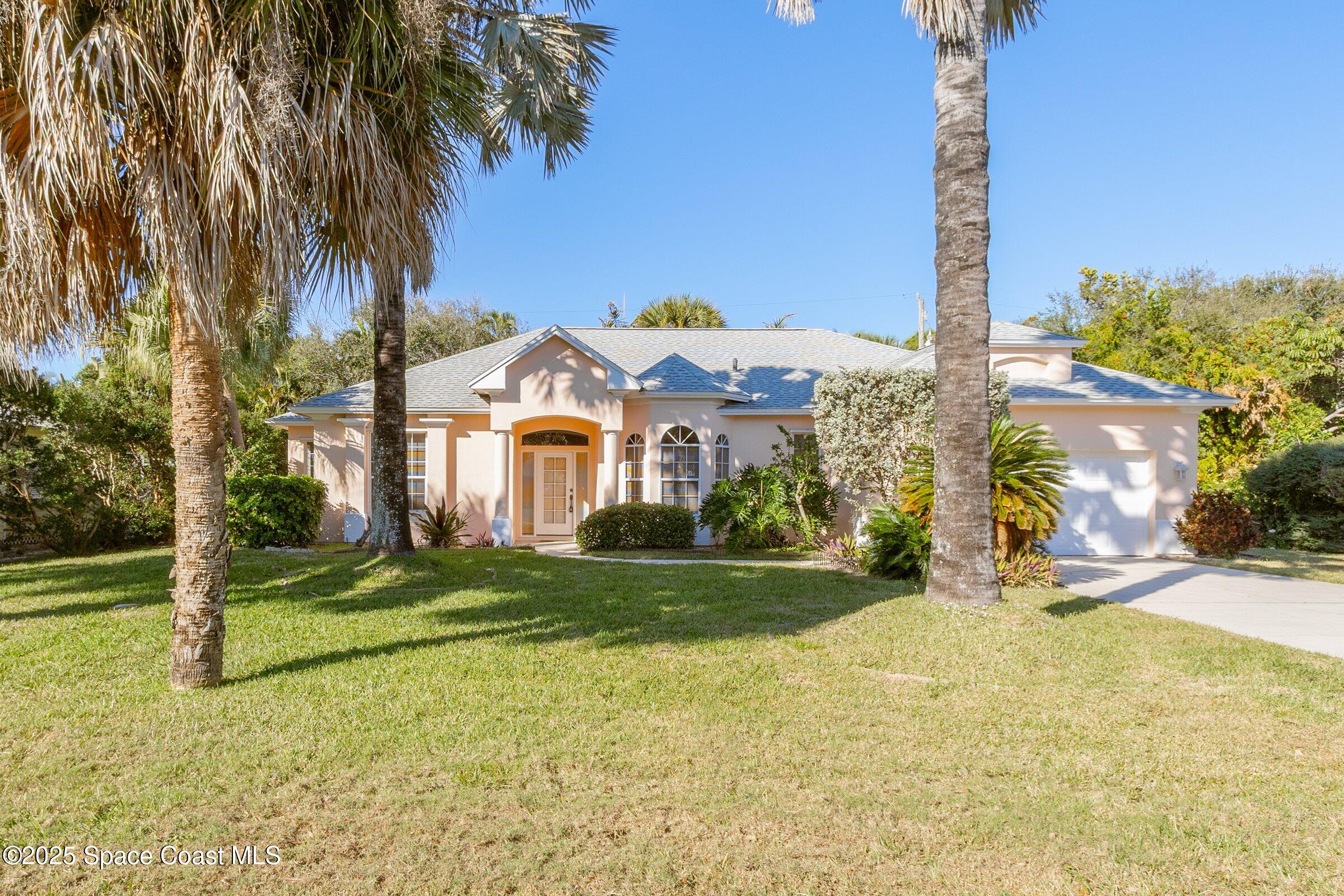 216 3rd Avenue Indialantic, FL 32903 - Photo 25 of 37 a front view of a house with a yard