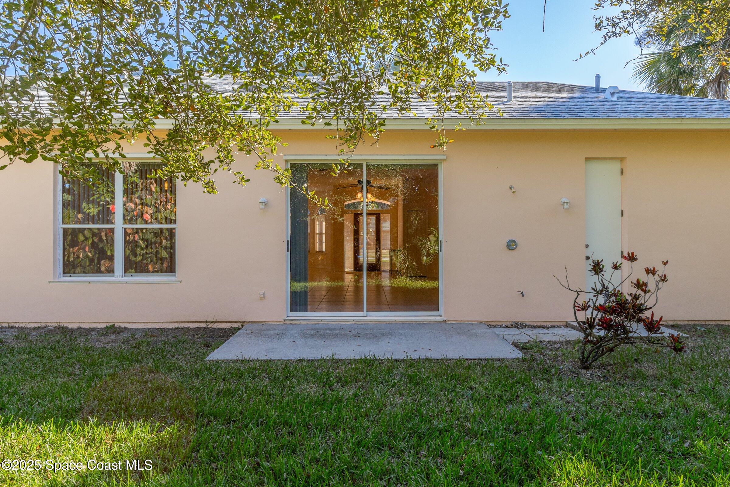 216 3rd Avenue Indialantic, FL 32903 - Photo 26 of 37 a front view of a house with a yard