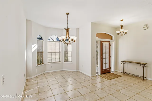 a view of an empty room with windows