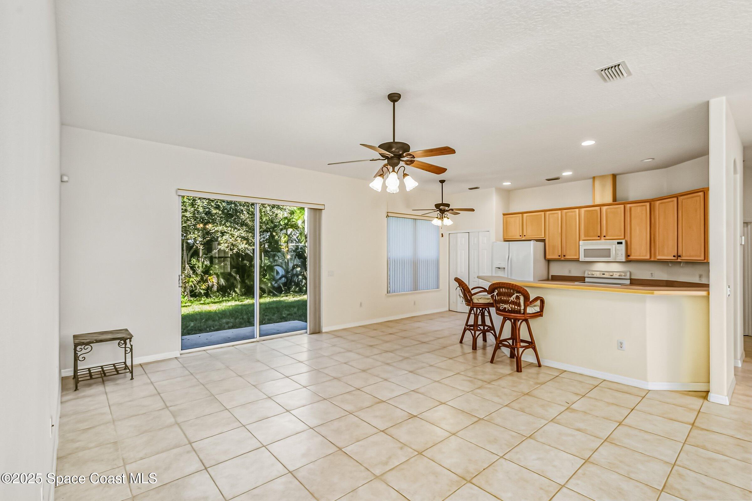 216 3rd Avenue Indialantic, FL 32903 - Photo 8 of 37 a dining room with furniture and window