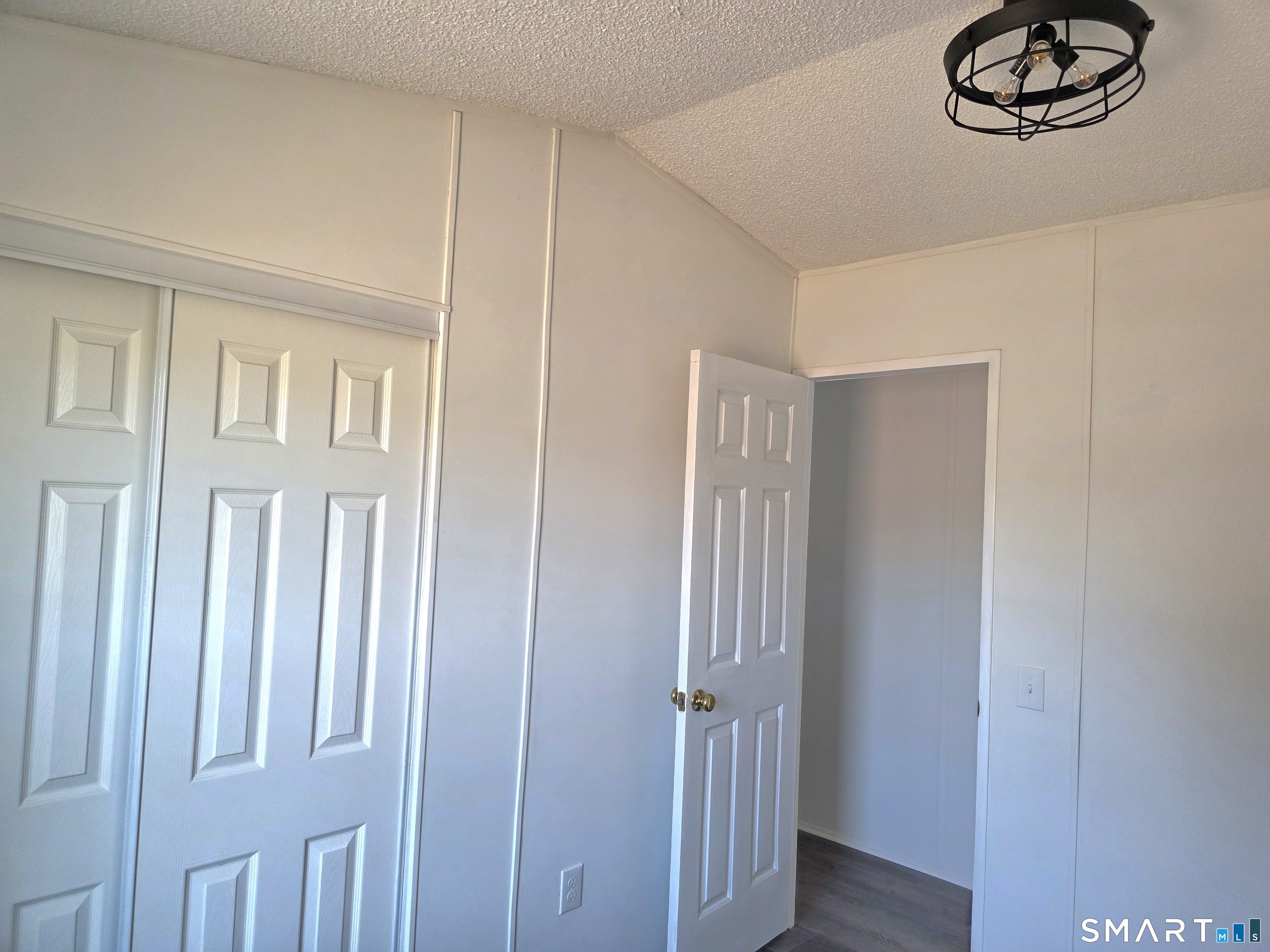 500 Washington Street, Unit 5 Middletown, CT 06457 - Photo 17 of 19 a view of a closet area with wooden floor